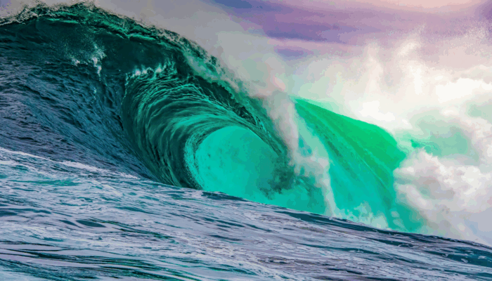 What are waves made of in quantum field theory?