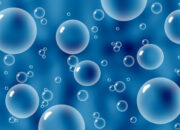 Bubbles Feel the Heat: Microscopic Collapse Meets Thermodynamics
