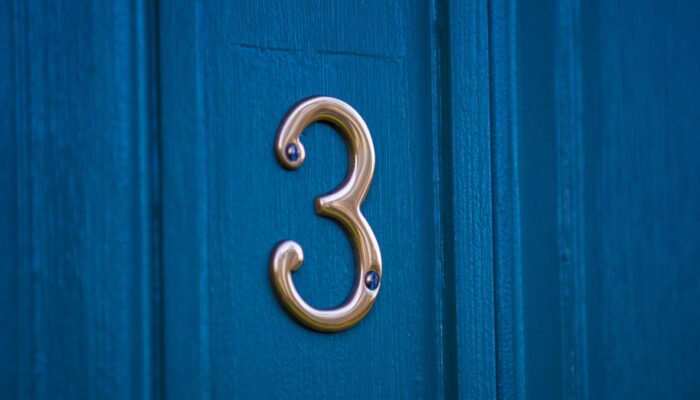 Which of the 3 subatomic particles is the smallest in mass?