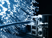 What is precisely the speed of light in fiber optics?