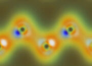 What happen at an atomic scale when light is reflected?